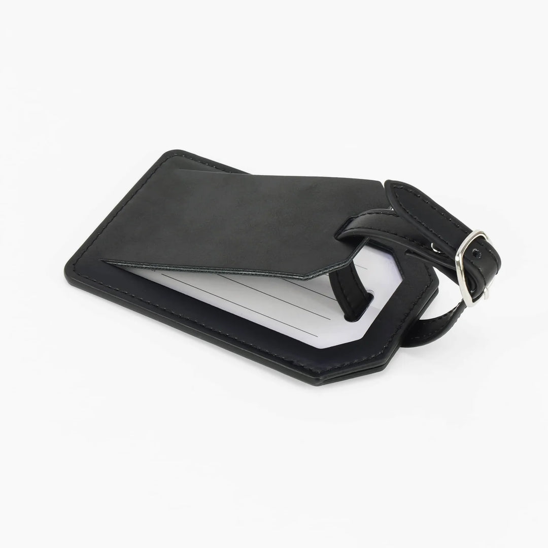 Black leatherette luggage tag open with privacy flap showing insert card and strap detail personalized engraved travel accessory
