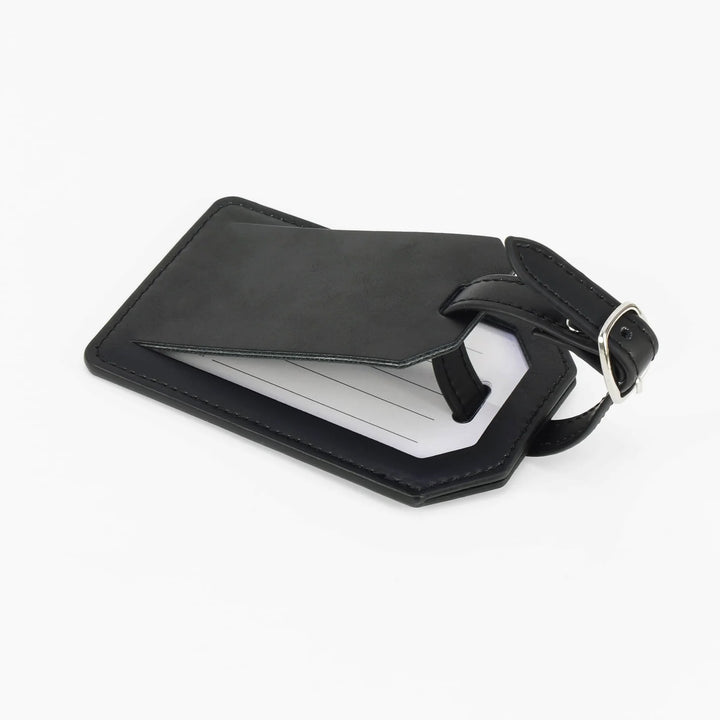 Black leatherette luggage tag open with privacy flap showing insert card and strap detail personalized engraved travel accessory