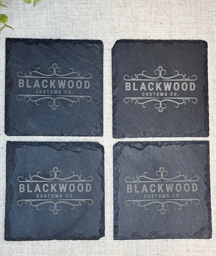Bulk order of personalized slate coasters with business logos for corporate gifting
