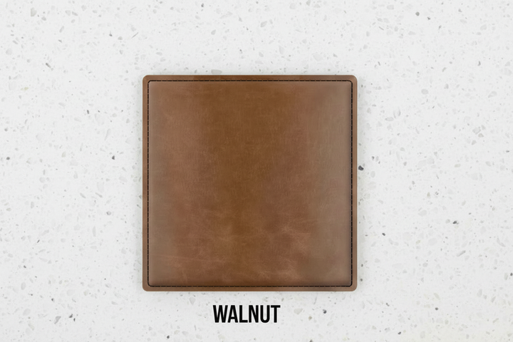 Set of four dark brown leatherette coasters with custom logo branding for weddings, events, and corporate gifts