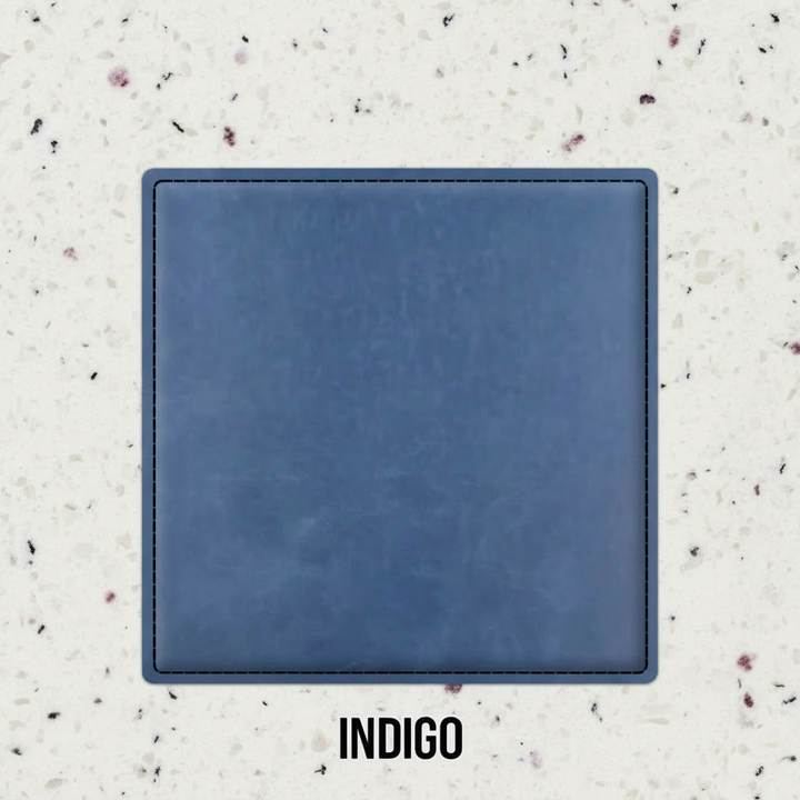 Set of four indigo leatherette coasters with custom logo branding for weddings, events, and corporate gifts