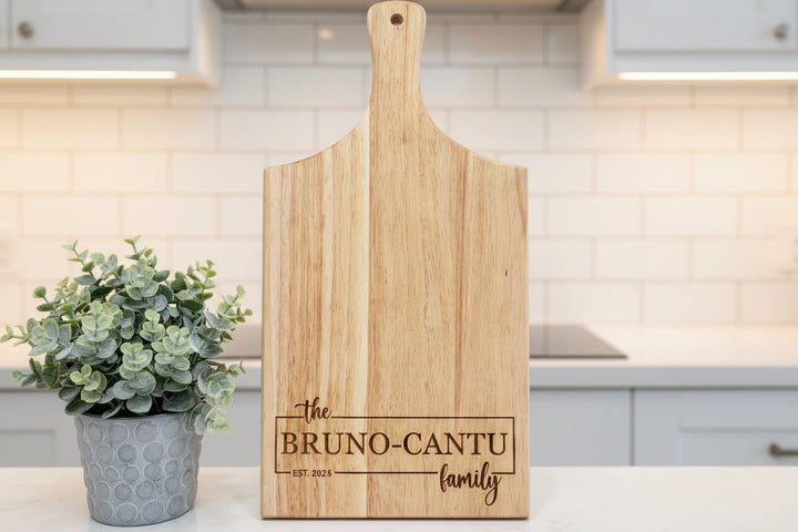 Custom rubberwood cutting board with engraved family name and date, personalized wedding or housewarming gift