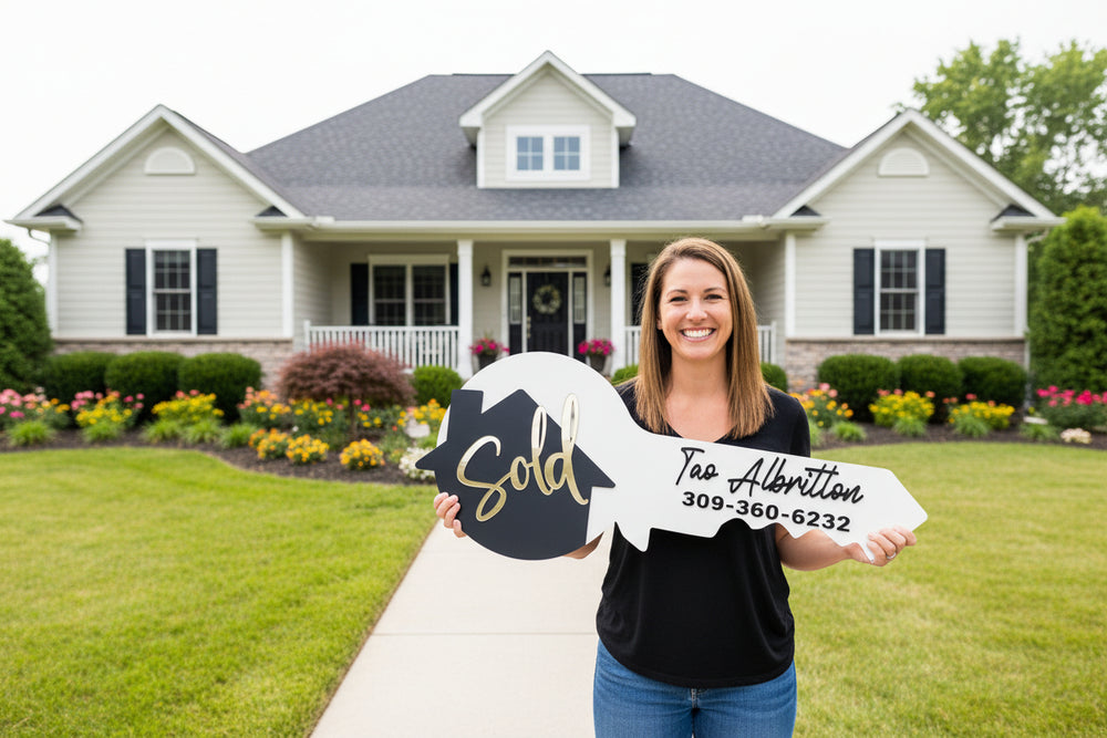 Client holding custom “Sold” key photo prop for real estate agent closing day marketing in front of new home