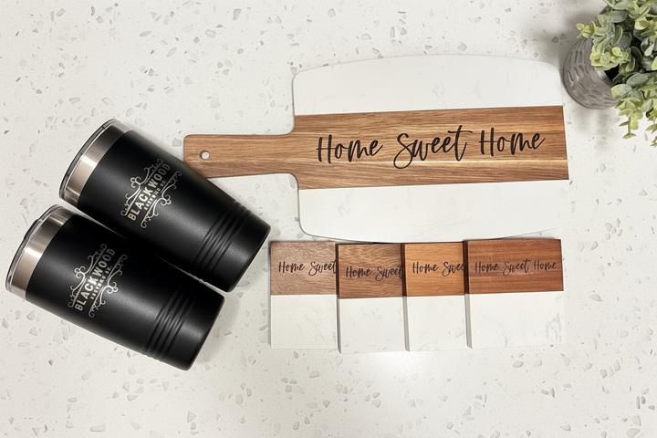 Marble and acacia wood gift set with engraved board, tumblers, and coaster set arranged for wedding and closing gifts