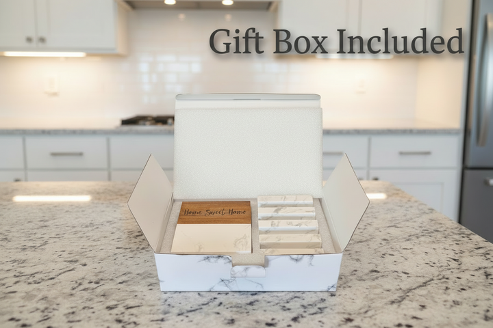 Marble and acacia wood coaster gift set in box with Home Sweet Home design displayed on kitchen countertop.