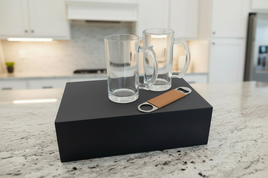 Personalized beer mug gift box set with two engraved glass beer mugs and a leatherette bottle opener displayed on a custom gift box, perfect groomsmen gift, birthday gift, or personalized barware gift set.