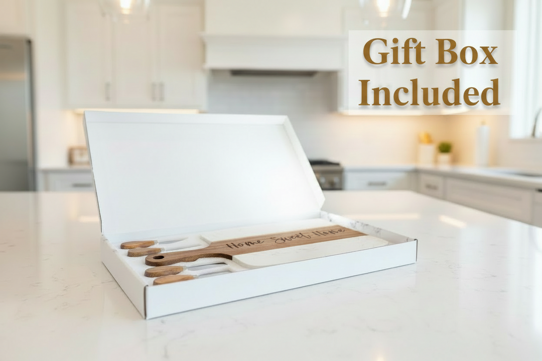 Personalized marble and acacia charcuterie board gift set in box with cheese knives engraved for housewarming or new homeowner gift.