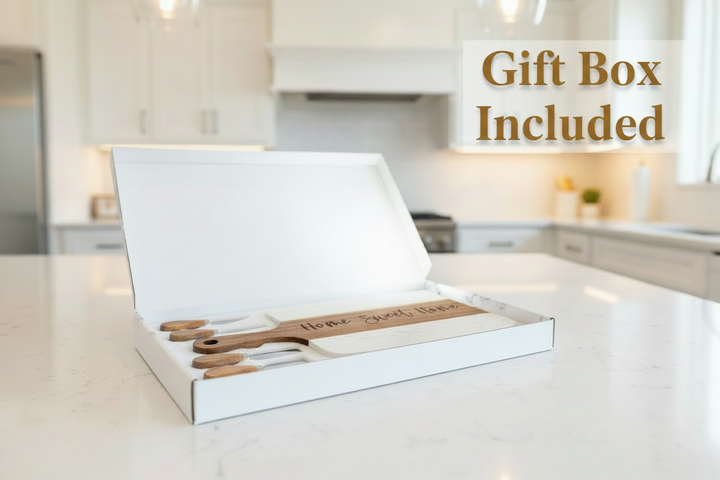 Personalized marble and acacia charcuterie board gift set in box with cheese knives engraved for housewarming or new homeowner gift.
